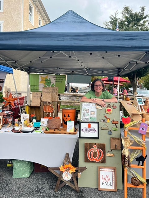 Sassafras Owner Sarah at the front of a First Friday Market set up